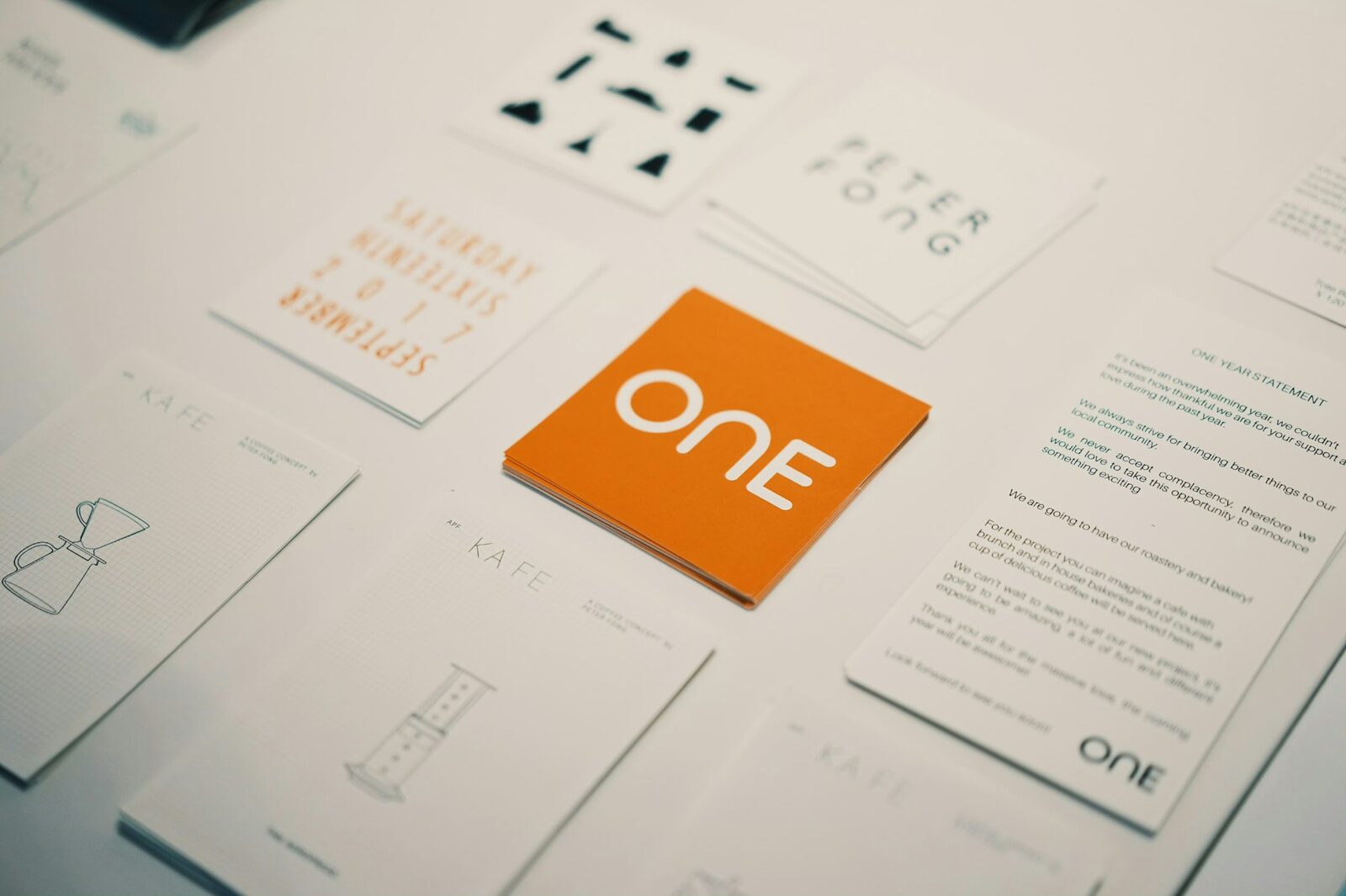 Brand identity cards and stationery with an orange logo card
